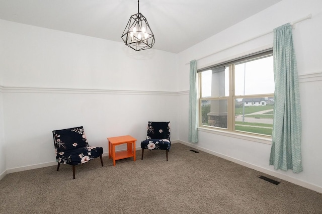 sitting room featuring visible vents, carpet flooring, and baseboards