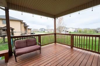 wooden terrace featuring a residential view and outdoor lounge area