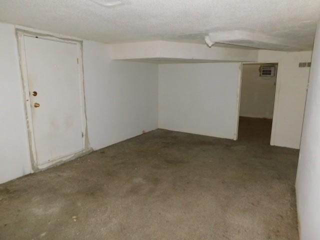 basement with a textured ceiling