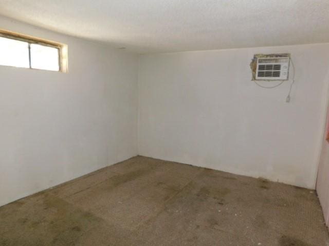 basement with a wall mounted AC