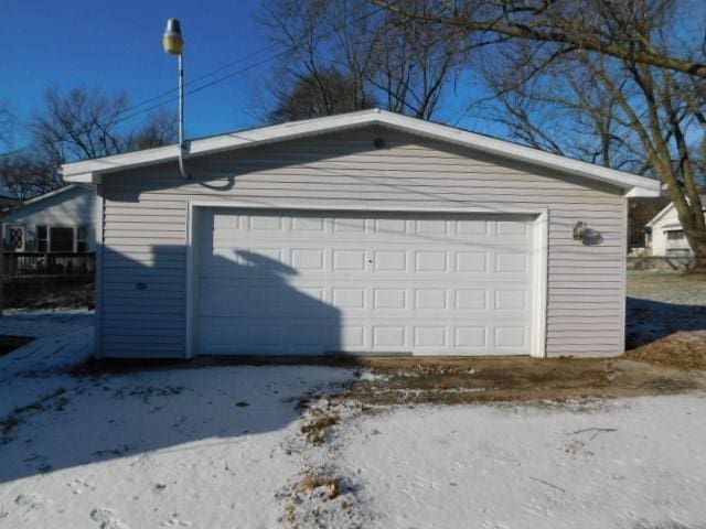 view of snow covered garage