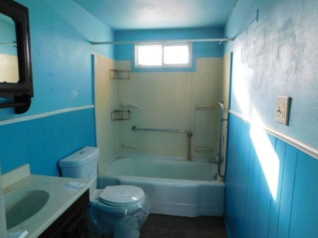 full bathroom featuring vanity, shower / bath combination, and toilet