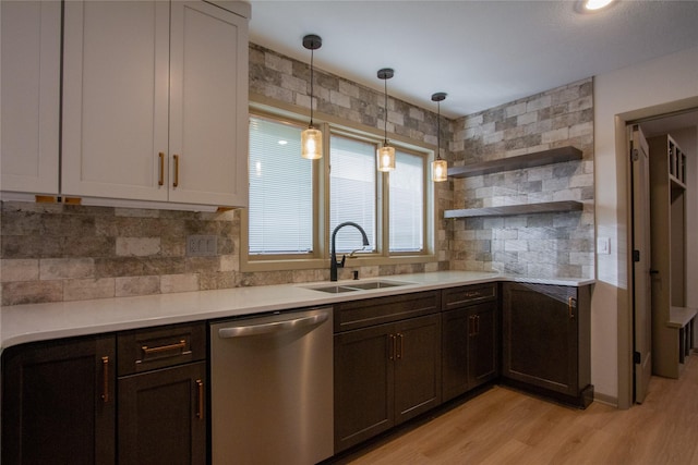 kitchen featuring decorative backsplash, dishwasher, light hardwood / wood-style flooring, and sink