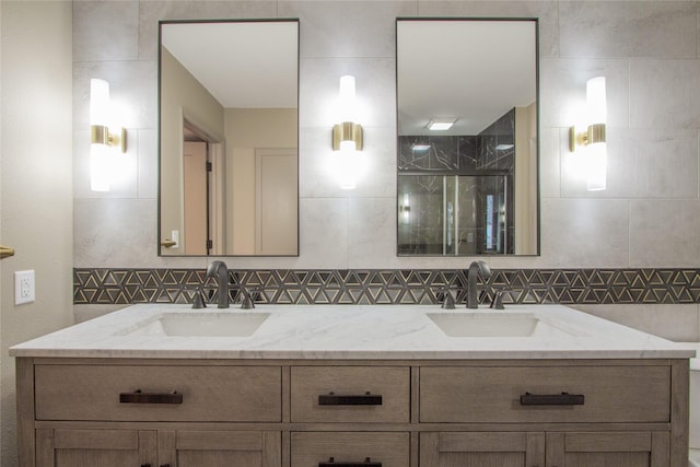 bathroom with backsplash, vanity, and an enclosed shower