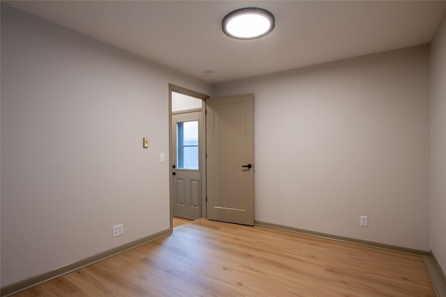 spare room with light hardwood / wood-style floors