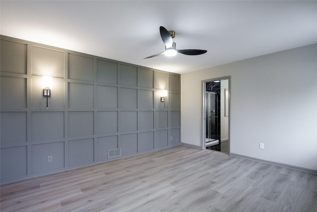 unfurnished bedroom with ceiling fan and light wood-type flooring