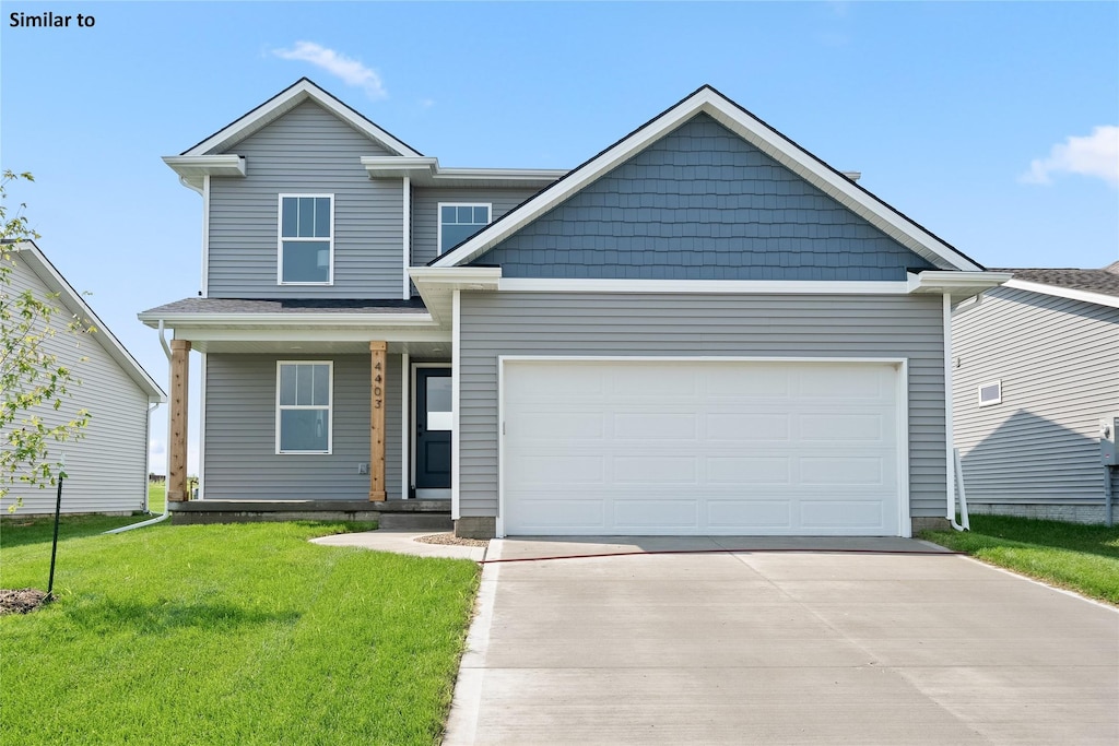 view of front of property with a garage and a front yard