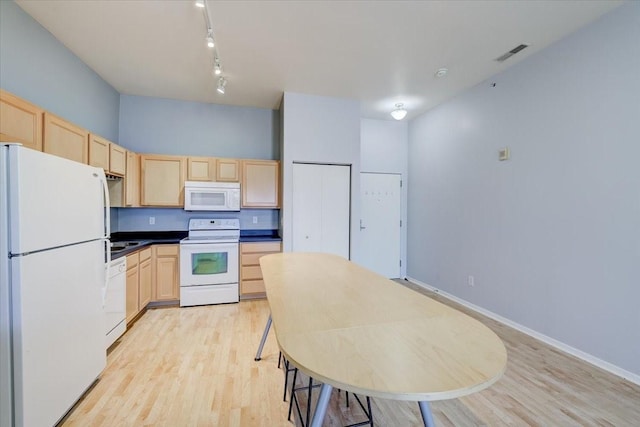 kitchen featuring track lighting, light hardwood / wood-style floors, light brown cabinets, and white appliances