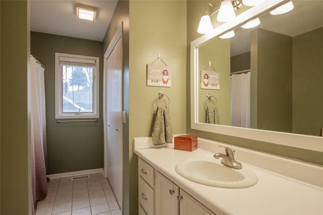 bathroom featuring tile patterned floors and vanity