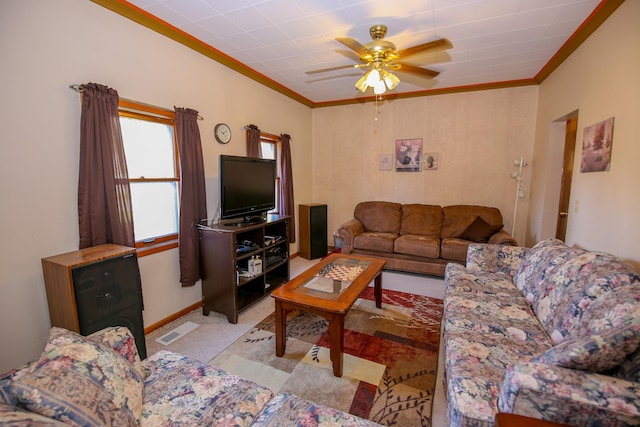 living room featuring ceiling fan and ornamental molding