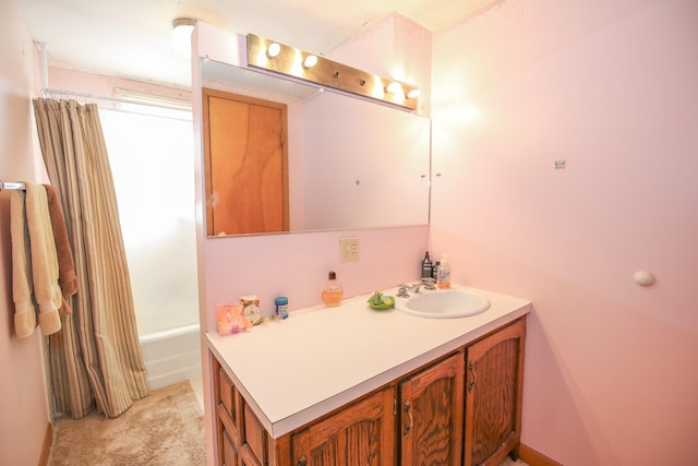 bathroom featuring vanity and tub / shower combination