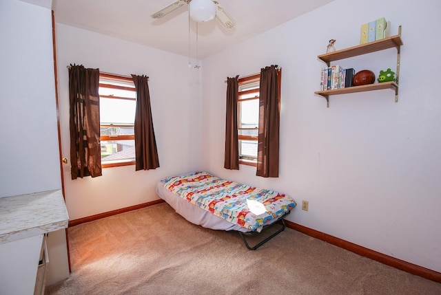 carpeted bedroom featuring ceiling fan