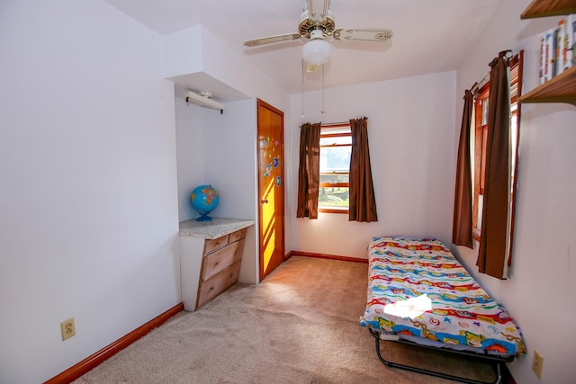 bedroom with ceiling fan and light colored carpet