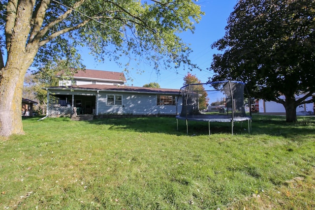 view of yard with a trampoline