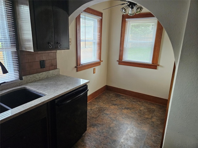 kitchen featuring ceiling fan, sink, decorative backsplash, and black dishwasher