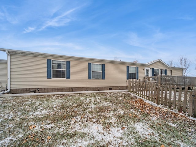 view of front of property featuring a wooden deck