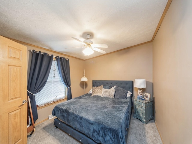 bedroom with carpet flooring, ceiling fan, and a textured ceiling