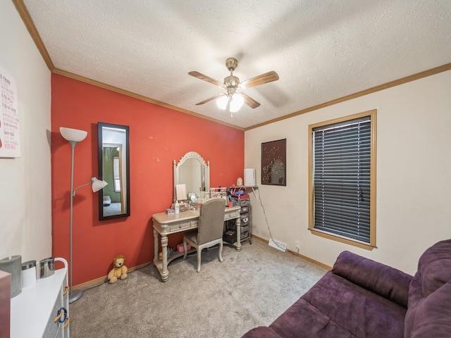 carpeted office with ceiling fan, crown molding, and a textured ceiling