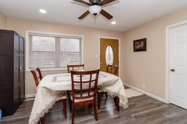 dining area with dark hardwood / wood-style flooring and ceiling fan