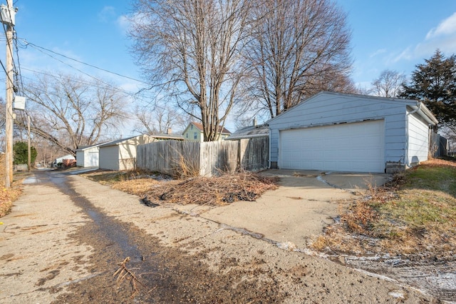 view of side of property with an outbuilding and a garage