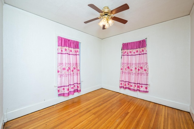 unfurnished room featuring ceiling fan and wood-type flooring