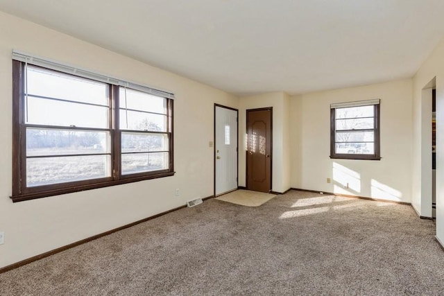 empty room with light colored carpet