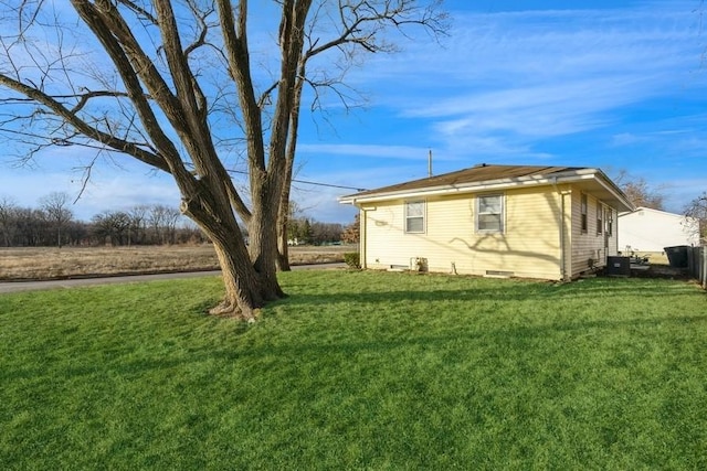 view of home's exterior featuring a yard and cooling unit