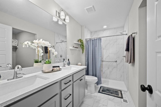 bathroom with vanity, toilet, and walk in shower