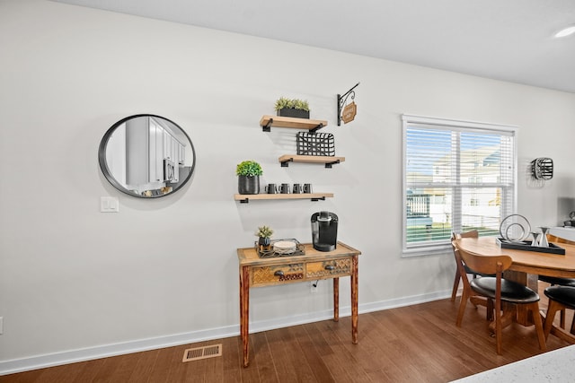 dining area with wood-type flooring