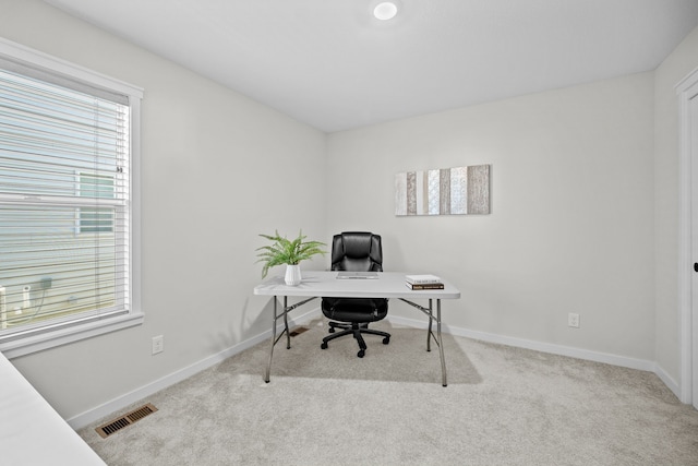 home office featuring light carpet