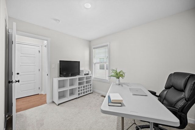 view of carpeted home office