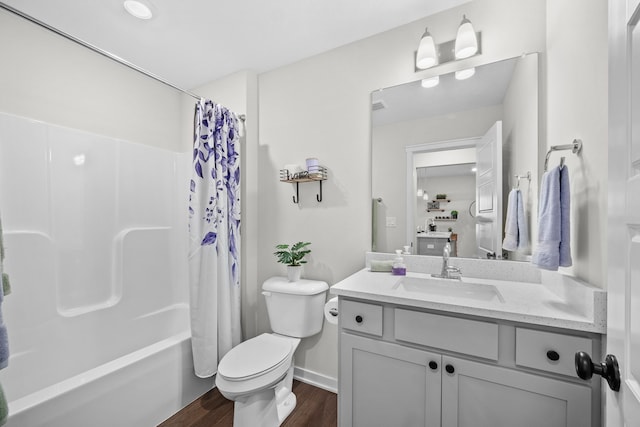 full bathroom featuring wood-type flooring, vanity, toilet, and shower / bathtub combination with curtain