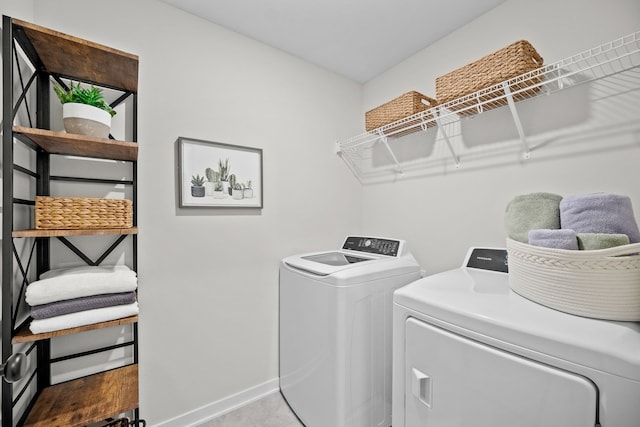 clothes washing area featuring washing machine and clothes dryer