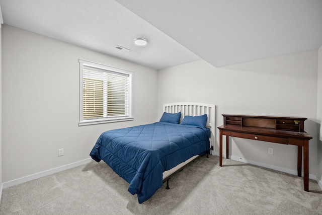 bedroom with light carpet