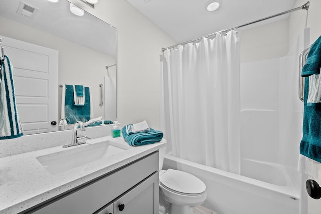 full bathroom featuring vanity, toilet, and shower / tub combo with curtain