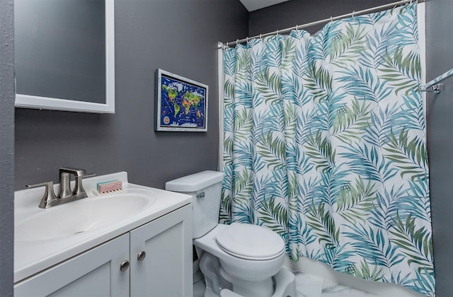 bathroom featuring toilet, a shower with curtain, and vanity