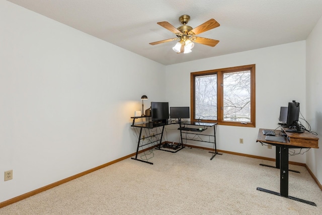 home office with ceiling fan and light colored carpet