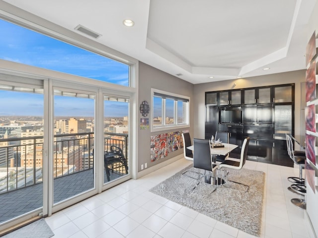 tiled home office featuring a tray ceiling