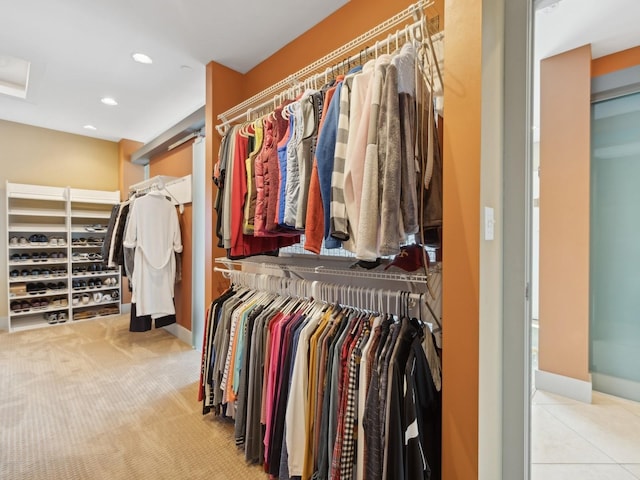 spacious closet with light colored carpet