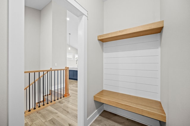 mudroom featuring baseboards and wood finished floors