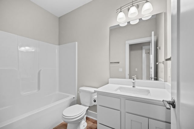 bathroom featuring shower / bathtub combination, vanity, toilet, and wood finished floors