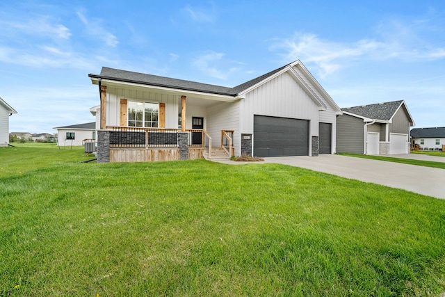 modern farmhouse featuring an attached garage, board and batten siding, a porch, central air condition unit, and driveway