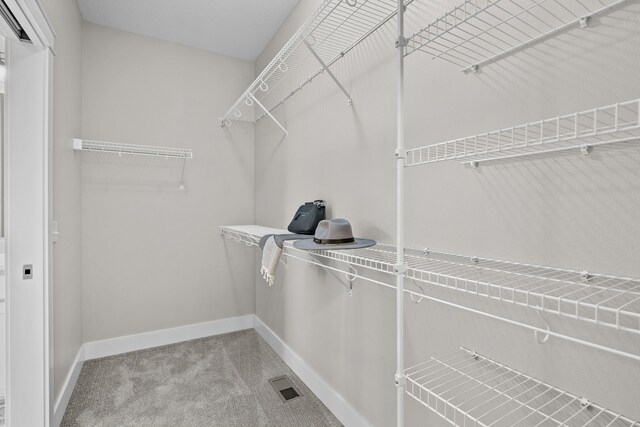 walk in closet with carpet flooring and visible vents