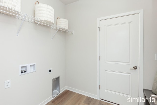 clothes washing area with baseboards, light wood-type flooring, washer hookup, laundry area, and hookup for an electric dryer