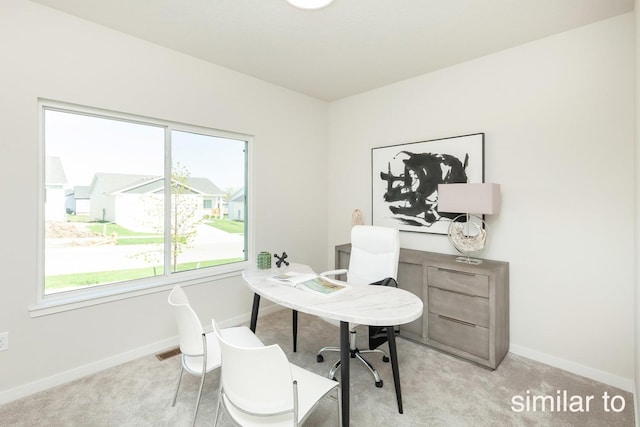 office featuring visible vents, baseboards, and carpet floors