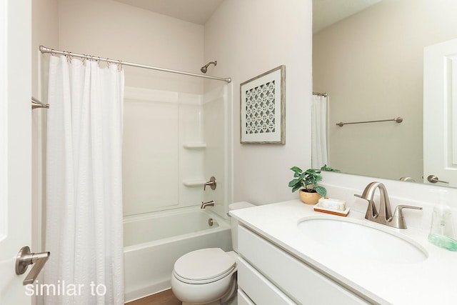 bathroom featuring shower / bath combo with shower curtain, toilet, and vanity