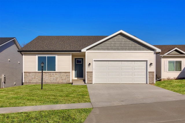 view of front of property with an attached garage, stone siding, a front yard, and concrete driveway