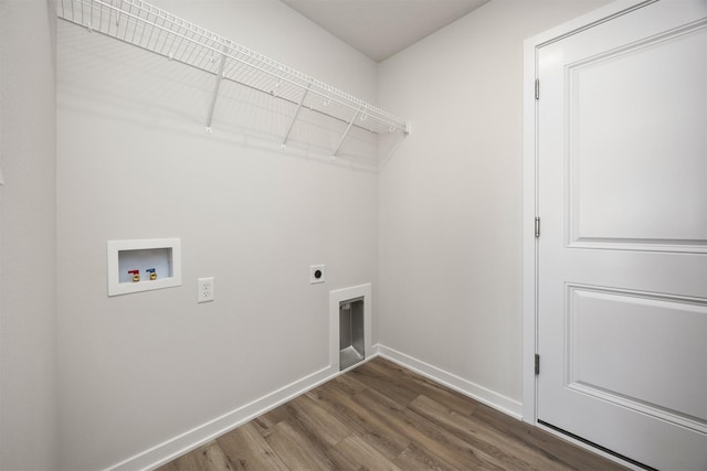 laundry room with baseboards, washer hookup, wood finished floors, electric dryer hookup, and laundry area