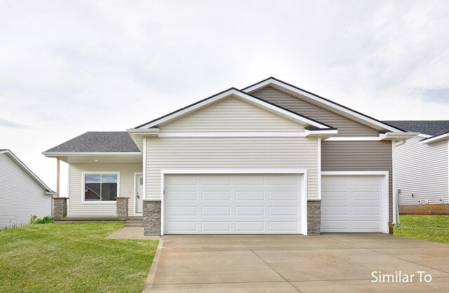 view of front facade with a garage and a front lawn