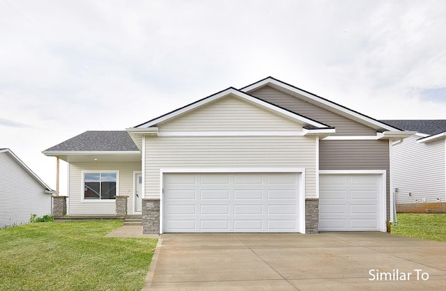 view of front of property with stone siding, an attached garage, and concrete driveway